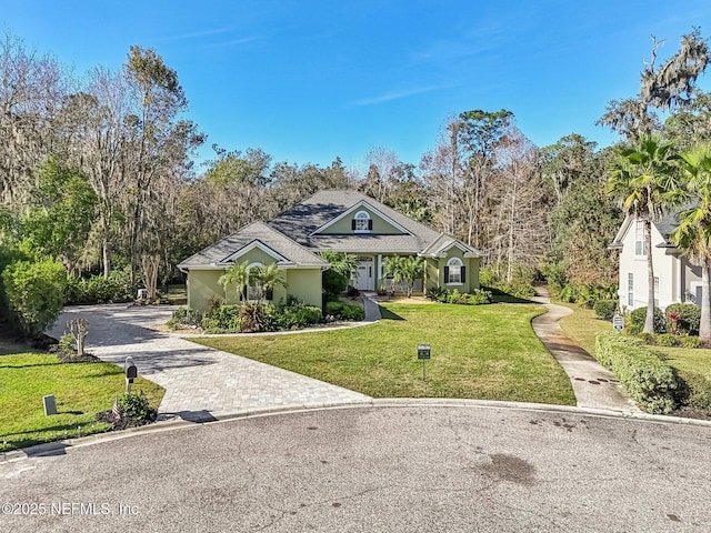 3461 Mainard Branch Ct, Fleming Island, FL 32003 - view of front facade with a front lawn, stucco siding, and driveway