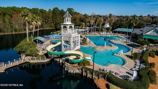 3461 Mainard Branch Ct, Fleming Island, FL 32003 - community pool featuring a water view, a water slide, a forest view, and a patio area