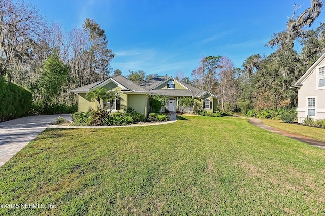3461 Mainard Branch Ct, Fleming Island, FL 32003 - view of front facade featuring stucco siding, driveway, and a front lawn