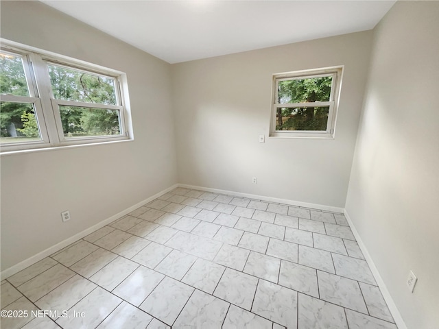 8636 Bermuda Rd, Jacksonville, FL 32208 - spare room with healthy amount of natural light and baseboards