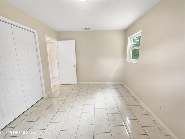 8636 Bermuda Rd, Jacksonville, FL 32208 - unfurnished bedroom featuring a closet and baseboards
