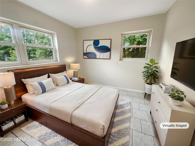 8636 Bermuda Rd, Jacksonville, FL 32208 - bedroom with multiple windows and baseboards