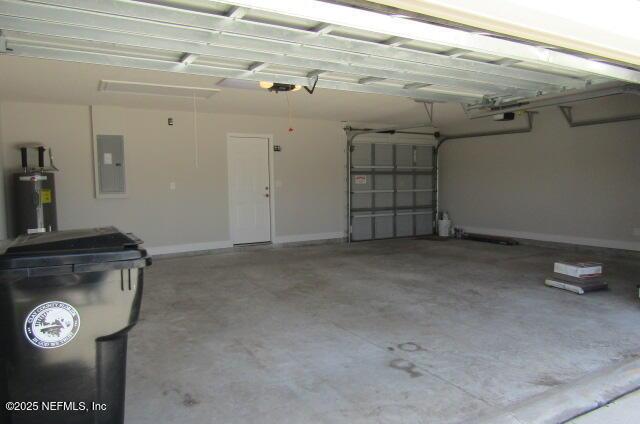2985 Vianey Pl, Green Cove Springs, FL 32043 - garage featuring electric panel, electric water heater, and a garage door opener