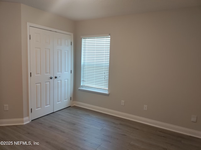 2985 Vianey Pl, Green Cove Springs, FL 32043 - unfurnished bedroom featuring baseboards and wood finished floors