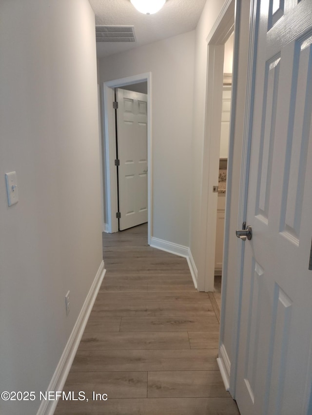 2985 Vianey Pl, Green Cove Springs, FL 32043 - corridor with wood finished floors and baseboards