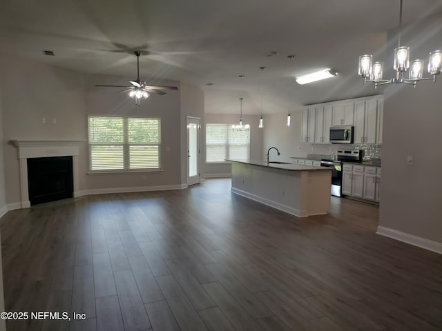 2985 Vianey Pl, Green Cove Springs, FL 32043 - kitchen with stainless steel appliances, a chandelier, open floor plan, dark wood-style flooring, and a sink