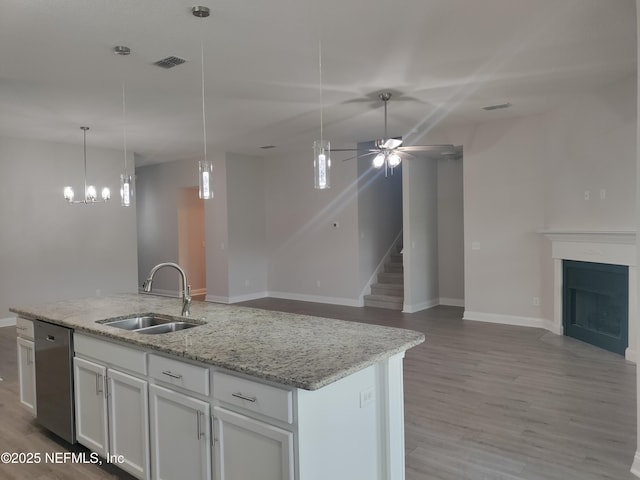 2985 Vianey Pl, Green Cove Springs, FL 32043 - kitchen with a sink, stainless steel dishwasher, open floor plan, an island with sink, and ceiling fan