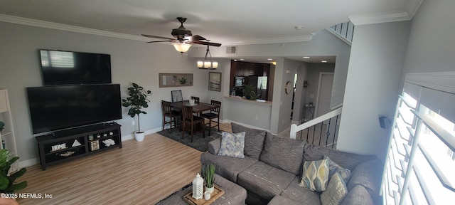 9745 Touchton Rd Unit 1521, Jacksonville, FL 32246 - living room featuring ornamental molding, light wood-type flooring, ceiling fan, baseboards, and stairs