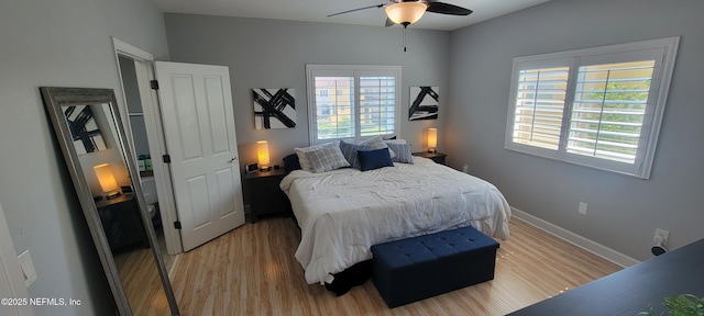 9745 Touchton Rd Unit 1521, Jacksonville, FL 32246 - bedroom with light wood-style floors, baseboards, and ceiling fan