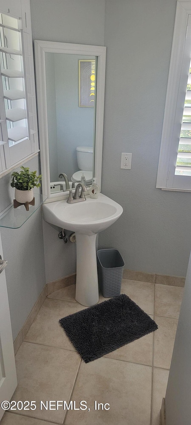 9745 Touchton Rd Unit 1521, Jacksonville, FL 32246 - bathroom featuring tile patterned floors and baseboards