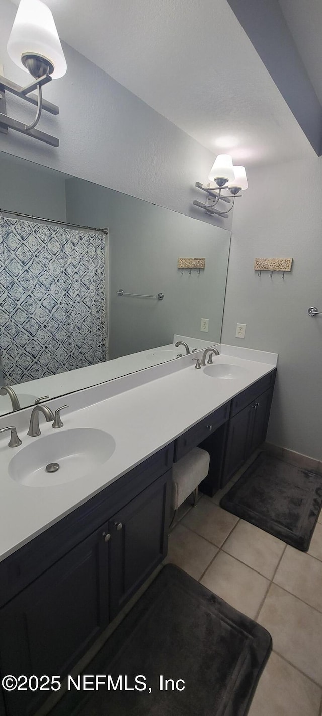 9745 Touchton Rd Unit 1521, Jacksonville, FL 32246 - bathroom with double vanity and tile patterned floors