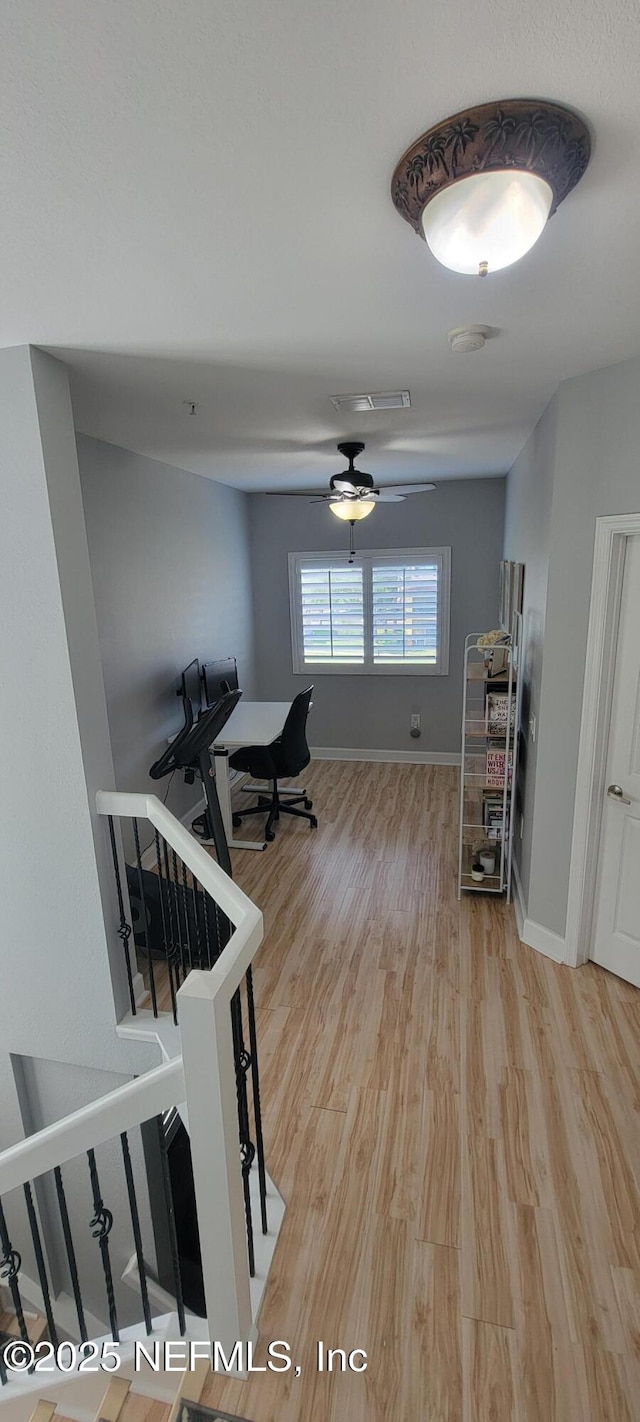 9745 Touchton Rd Unit 1521, Jacksonville, FL 32246 - corridor featuring light wood-style floors, baseboards, and an upstairs landing