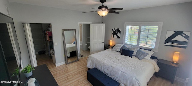 9745 Touchton Rd Unit 1521, Jacksonville, FL 32246 - bedroom featuring light wood-style flooring, baseboards, a spacious closet, and ceiling fan