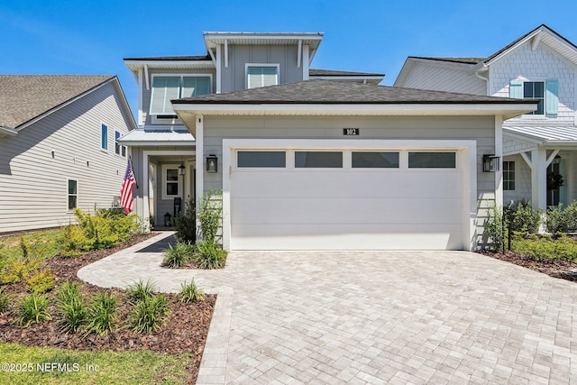 102 Blue Oak Ct, Ponte Vedra, FL 32081 - view of front of property with decorative driveway, an attached garage, board and batten siding, and metal roof