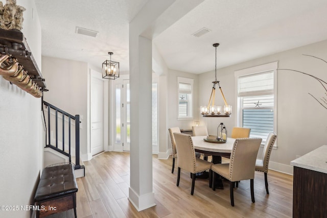 102 Blue Oak Ct, Ponte Vedra, FL 32081 - dining space featuring a chandelier, light wood finished floors, stairs, and baseboards