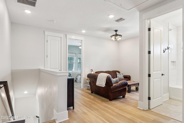 102 Blue Oak Ct, Ponte Vedra, FL 32081 - living room with light wood-style flooring, attic access, and recessed lighting