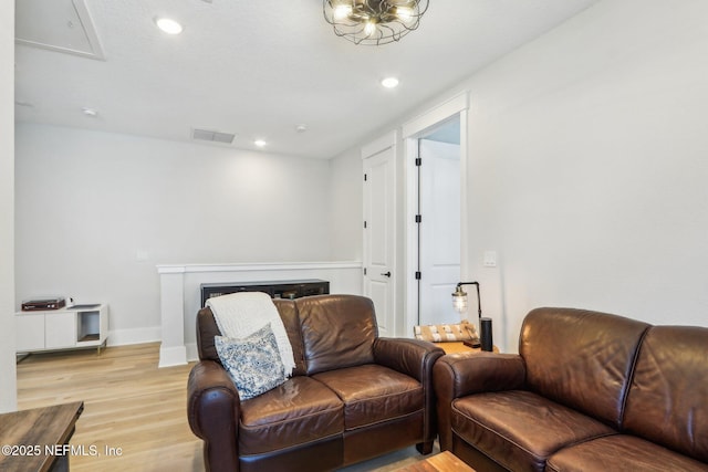 102 Blue Oak Ct, Ponte Vedra, FL 32081 - living area with light wood finished floors, recessed lighting, a fireplace, and baseboards