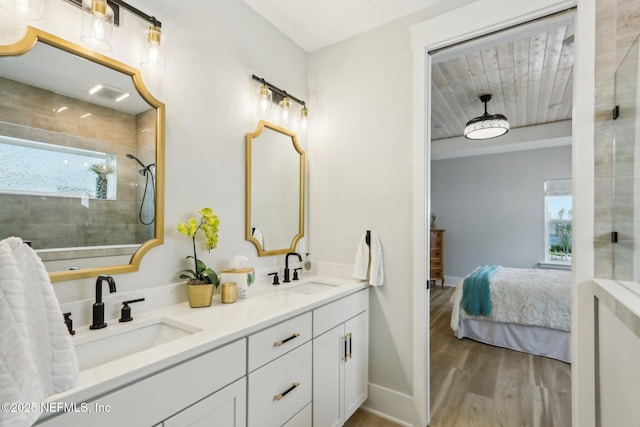 102 Blue Oak Ct, Ponte Vedra, FL 32081 - ensuite bathroom featuring wood finished floors, a tile shower, double vanity, and baseboards