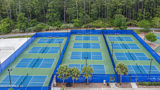 102 Blue Oak Ct, Ponte Vedra, FL 32081 - view of tennis court with a wooded view