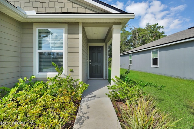 3075 Rustic Deer Way, Green Cove Springs, FL 32043 - view of exterior entry featuring a lawn