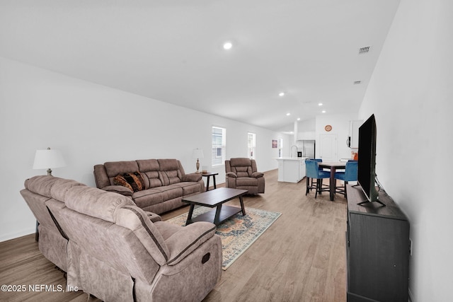 3075 Rustic Deer Way, Green Cove Springs, FL 32043 - living area with recessed lighting, light wood-type flooring, and vaulted ceiling