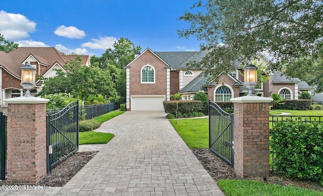 3355 Bishop Estates Rd, Saint Johns, FL 32259 - traditional-style house with a gate, a garage, and decorative driveway
