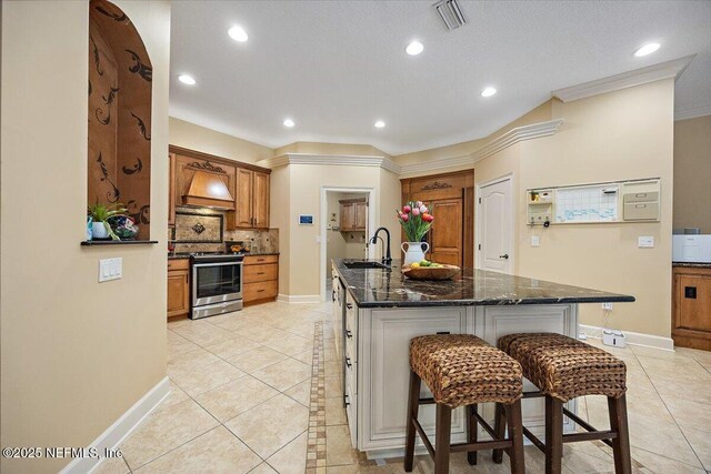 3355 Bishop Estates Rd, Saint Johns, FL 32259 - kitchen featuring stainless steel stove, a sink, light tile patterned flooring, backsplash, and recessed lighting