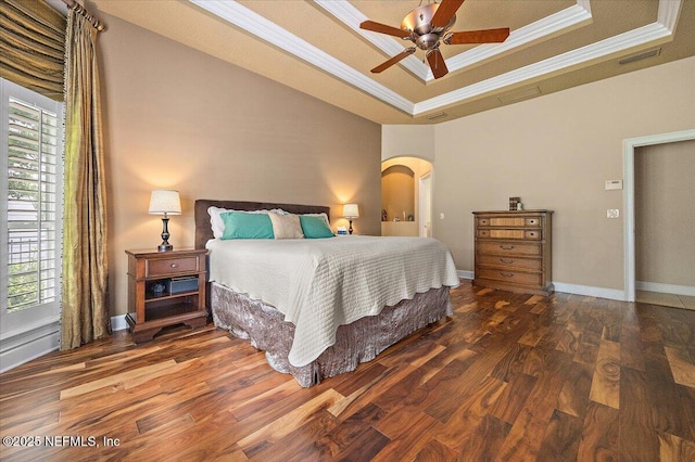 3355 Bishop Estates Rd, Saint Johns, FL 32259 - bedroom with a tray ceiling, crown molding, arched walkways, wood finished floors, and multiple windows