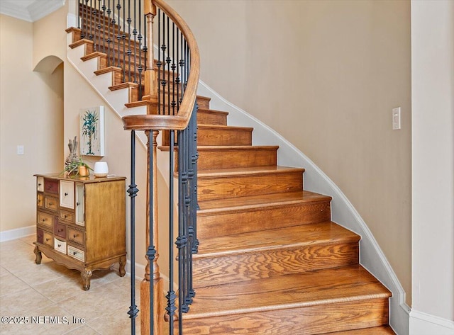 3355 Bishop Estates Rd, Saint Johns, FL 32259 - stairway with baseboards, tile patterned flooring, and crown molding
