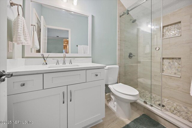 3355 Bishop Estates Rd, Saint Johns, FL 32259 - bathroom featuring toilet, a stall shower, and vanity