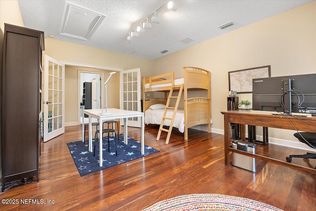 3355 Bishop Estates Rd, Saint Johns, FL 32259 - office featuring french doors, wood finished floors, track lighting, baseboards, and a textured ceiling