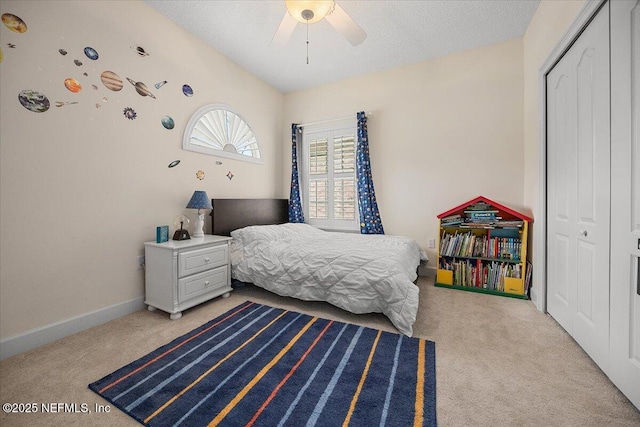 3355 Bishop Estates Rd, Saint Johns, FL 32259 - bedroom with light carpet, a closet, a ceiling fan, and baseboards