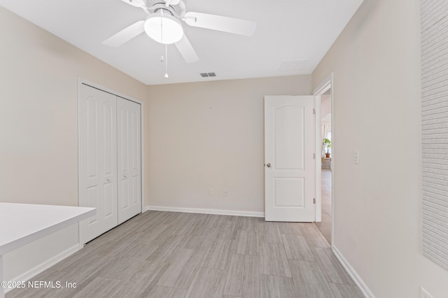 186 Ocean Cay Blvd, Saint Augustine, FL 32080 - unfurnished bedroom with light wood-type flooring, baseboards, a closet, and a ceiling fan