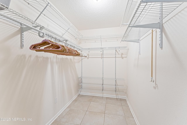 186 Ocean Cay Blvd, Saint Augustine, FL 32080 - walk in closet with light tile patterned flooring