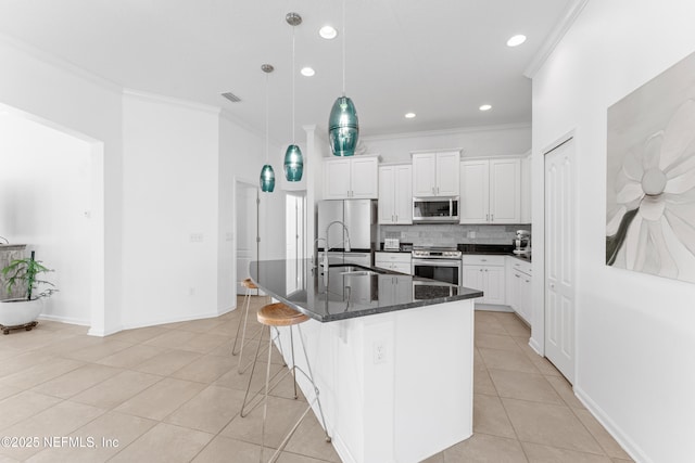 186 Ocean Cay Blvd, Saint Augustine, FL 32080 - kitchen featuring stainless steel appliances, crown molding, light tile patterned floors, a sink, and tasteful backsplash