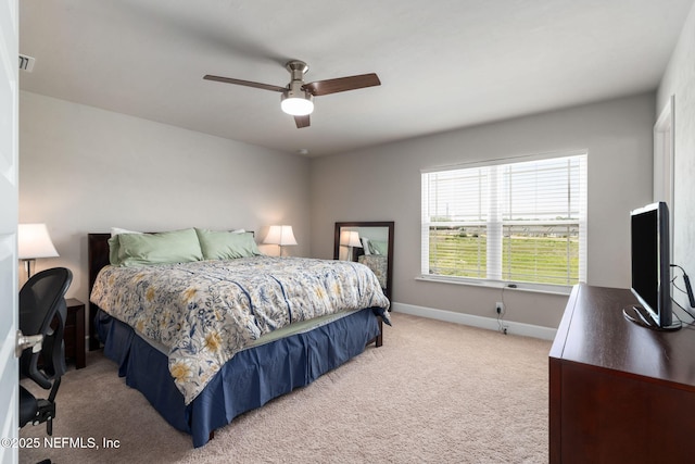 bedroom featuring carpet floors, baseboards, and a ceiling fan