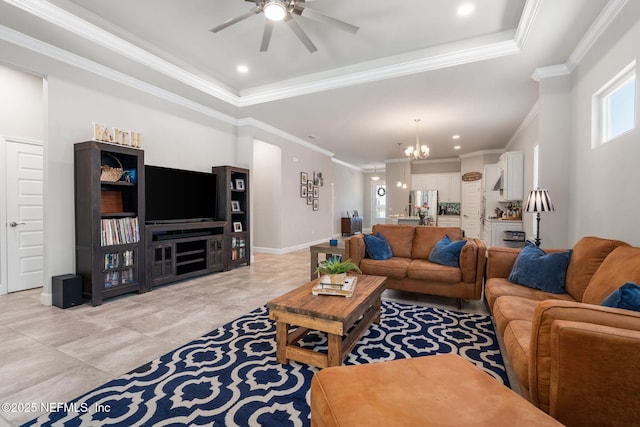 living room with a ceiling fan, a chandelier, a raised ceiling, crown molding, and light tile patterned floors