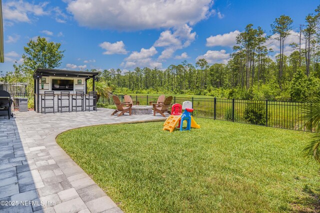 310 Cedarstone Way, Saint Augustine, FL 32092 - view of yard featuring an outdoor fire pit and a patio