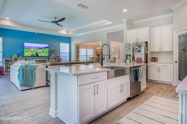 310 Cedarstone Way, Saint Augustine, FL 32092 - kitchen featuring a sink, stainless steel dishwasher, open floor plan, light wood finished floors, and a ceiling fan