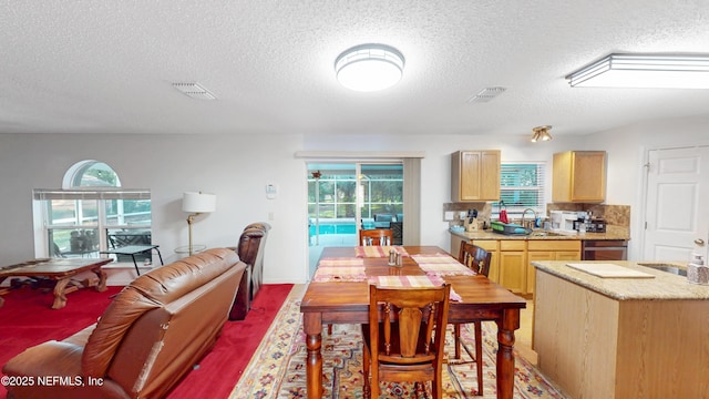 124 Lindsay Dr, Palm Coast, FL 32137 - dining area with a textured ceiling