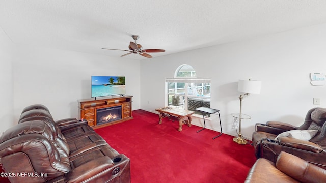 124 Lindsay Dr, Palm Coast, FL 32137 - living room featuring carpet floors, a textured ceiling, ceiling fan, and a lit fireplace