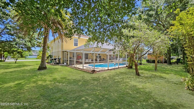 124 Lindsay Dr, Palm Coast, FL 32137 - swimming pool with a yard and a lanai