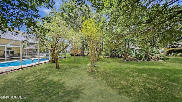 124 Lindsay Dr, Palm Coast, FL 32137 - view of green lawn featuring an outdoor pool and a lanai