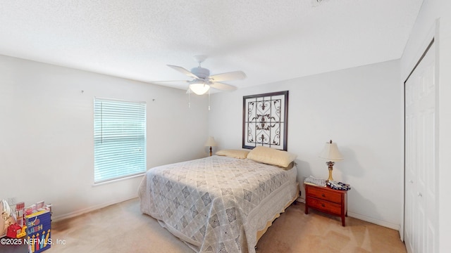 124 Lindsay Dr, Palm Coast, FL 32137 - bedroom featuring light carpet, baseboards, a closet, and a ceiling fan
