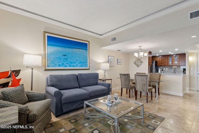 278 Sandcastles Ct, Fernandina Beach, FL 32034 - living area with a chandelier, ornamental molding, recessed lighting, and baseboards