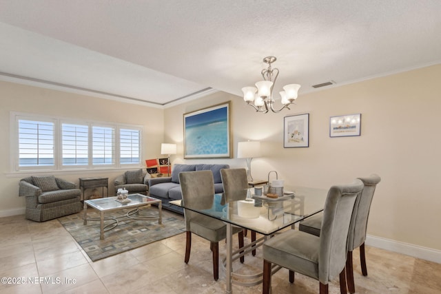 278 Sandcastles Ct, Fernandina Beach, FL 32034 - dining space with a chandelier, crown molding, baseboards, and light tile patterned flooring