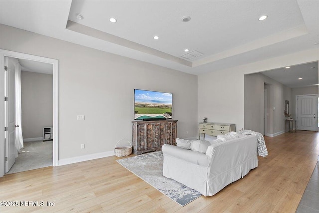 45 Waterwheel Ct, Saint Johns, FL 32259 - living area featuring a raised ceiling, light wood-style floors, recessed lighting, and baseboards