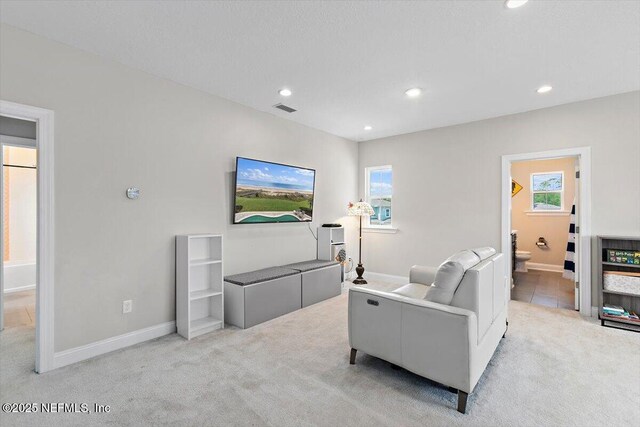 45 Waterwheel Ct, Saint Johns, FL 32259 - living area featuring light carpet, recessed lighting, baseboards, and plenty of natural light
