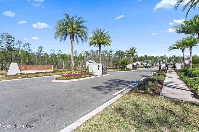 45 Waterwheel Ct, Saint Johns, FL 32259 - view of asphalt street with curbs, a gated entry, and sidewalks