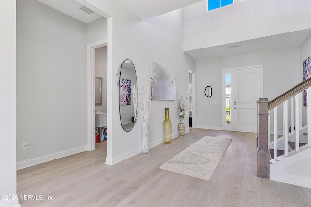 144 Waverly Way, Saint Johns, FL 32259 - foyer with light wood finished floors, stairs, and baseboards